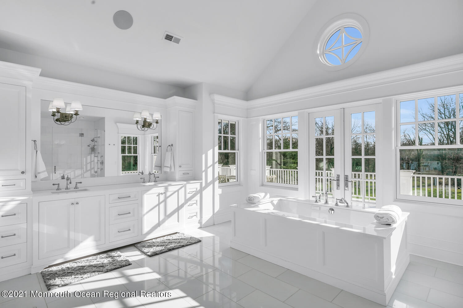 83 Rumson Road Rumson, NJ 07760 - Photo 25 of 56 a large white kitchen with a large window and stainless steel appliances