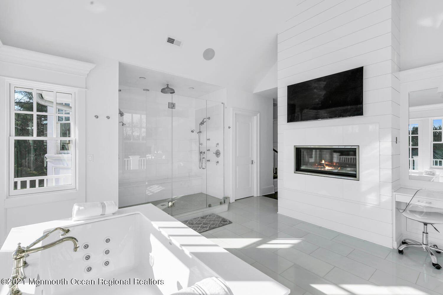 83 Rumson Road Rumson, NJ 07760 - Photo 27 of 56 a living room with a flat screen tv and a fireplace