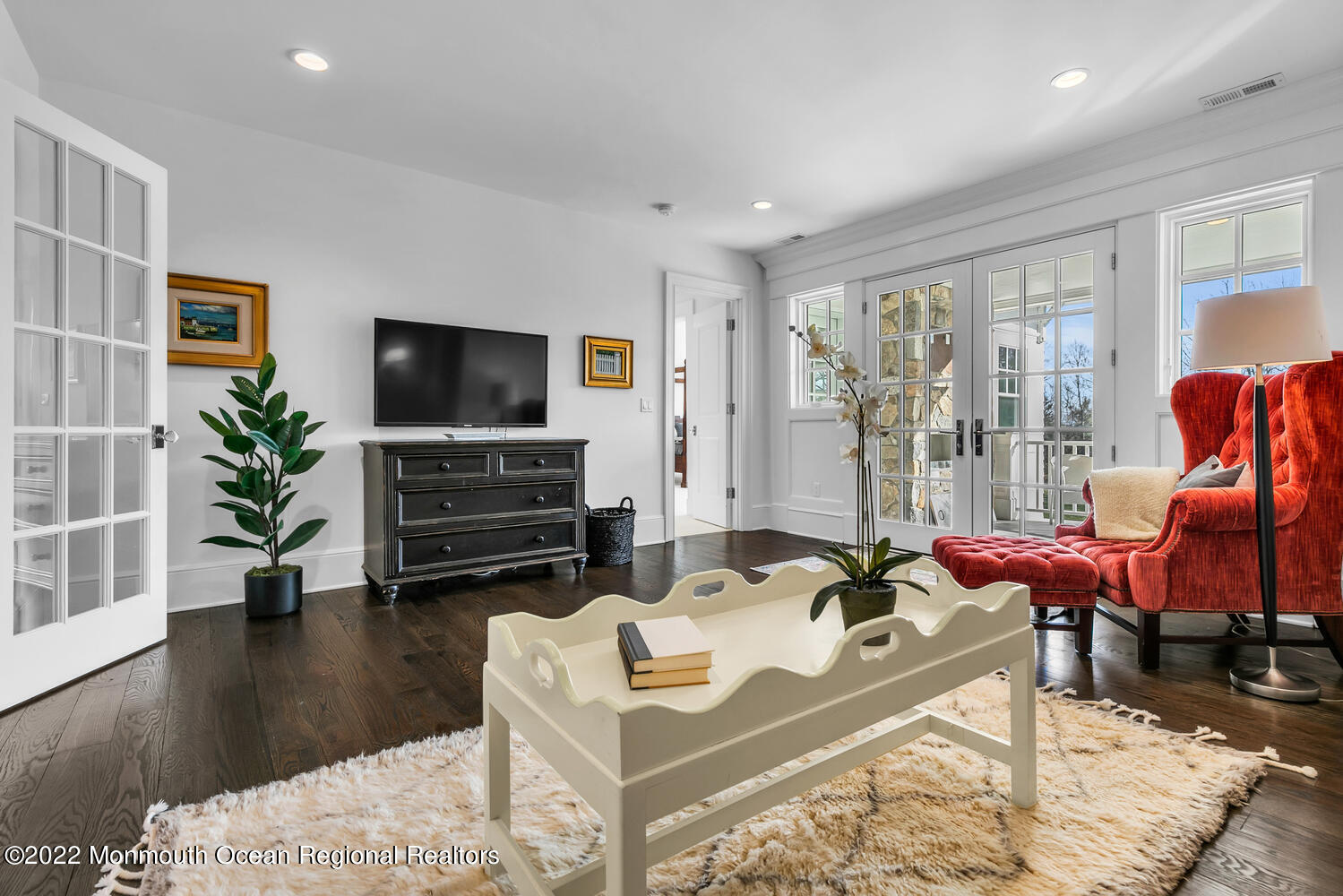 83 Rumson Road Rumson, NJ 07760 - Photo 30 of 56 a living room with furniture a flat screen tv and a large window