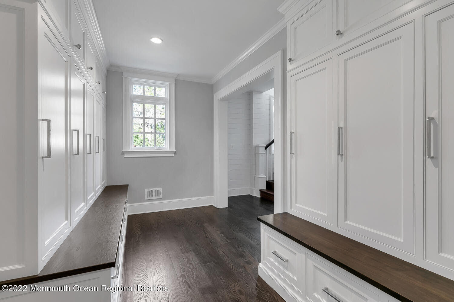 83 Rumson Road Rumson, NJ 07760 - Photo 41 of 56 a view of an empty room with wooden floor and a window