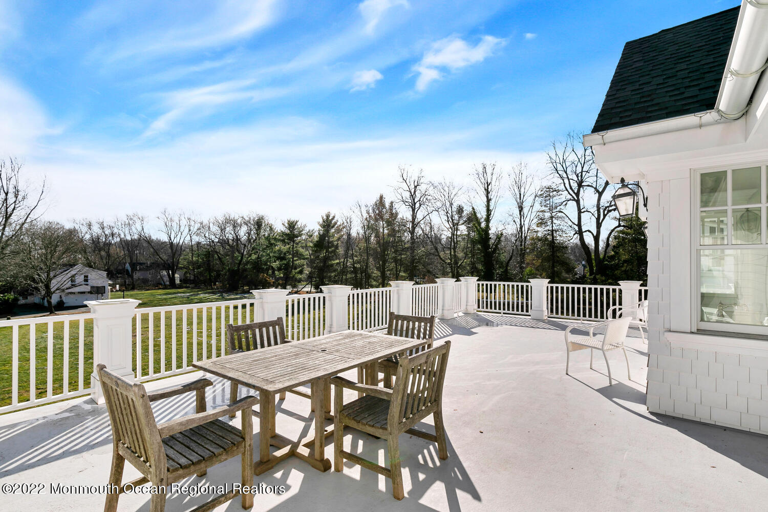 83 Rumson Road Rumson, NJ 07760 - Photo 50 of 56 a view of a patio with a table and chairs