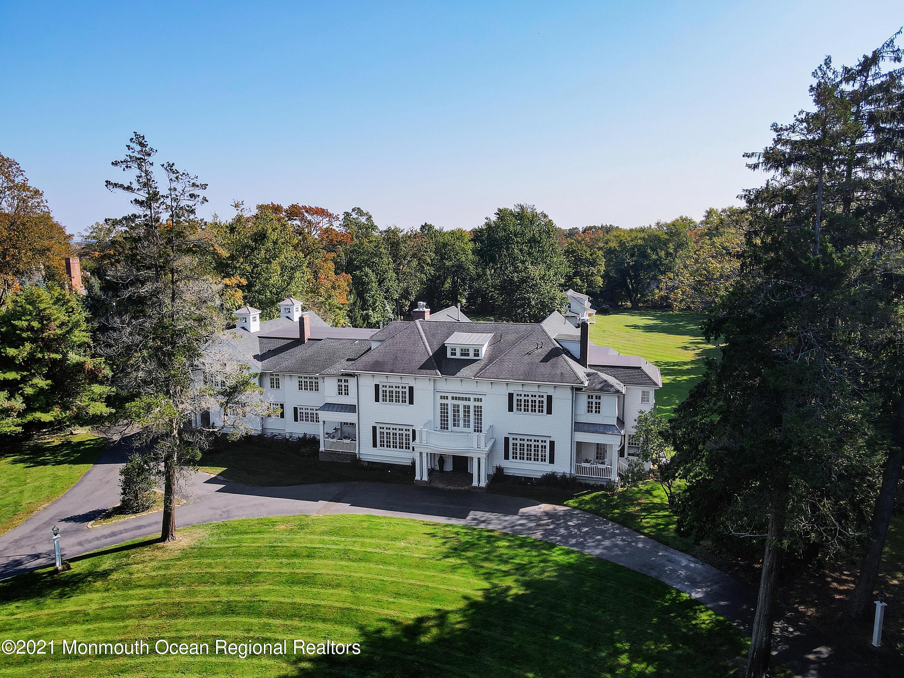 83 Rumson Road Rumson, NJ 07760 - Photo 56 of 56 a view of house with garden and tall trees