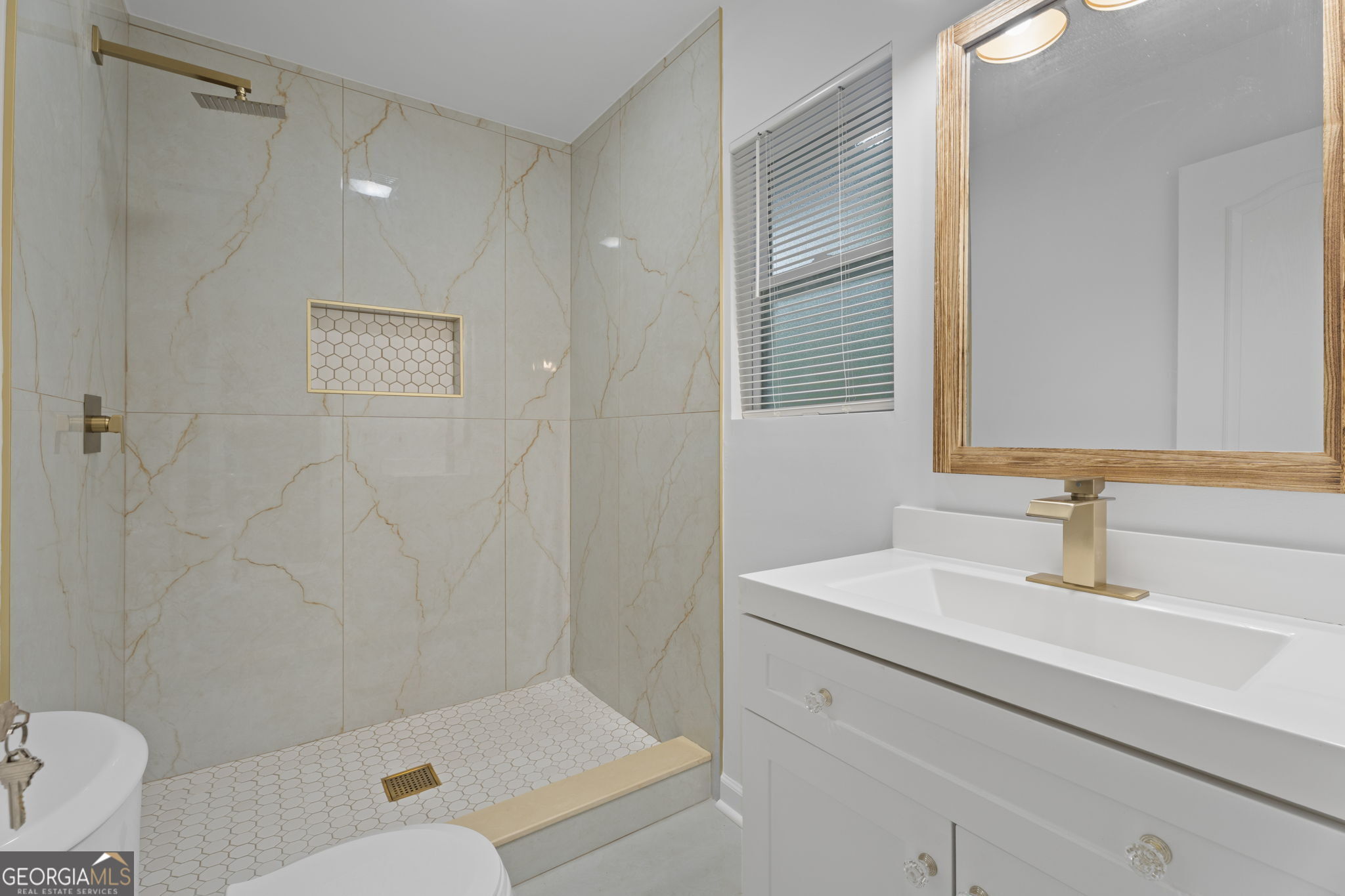 3567 Forrest Park Road Southeast Atlanta, GA 30354 - Photo 21 of 29 a bathroom with a sink and a mirror
