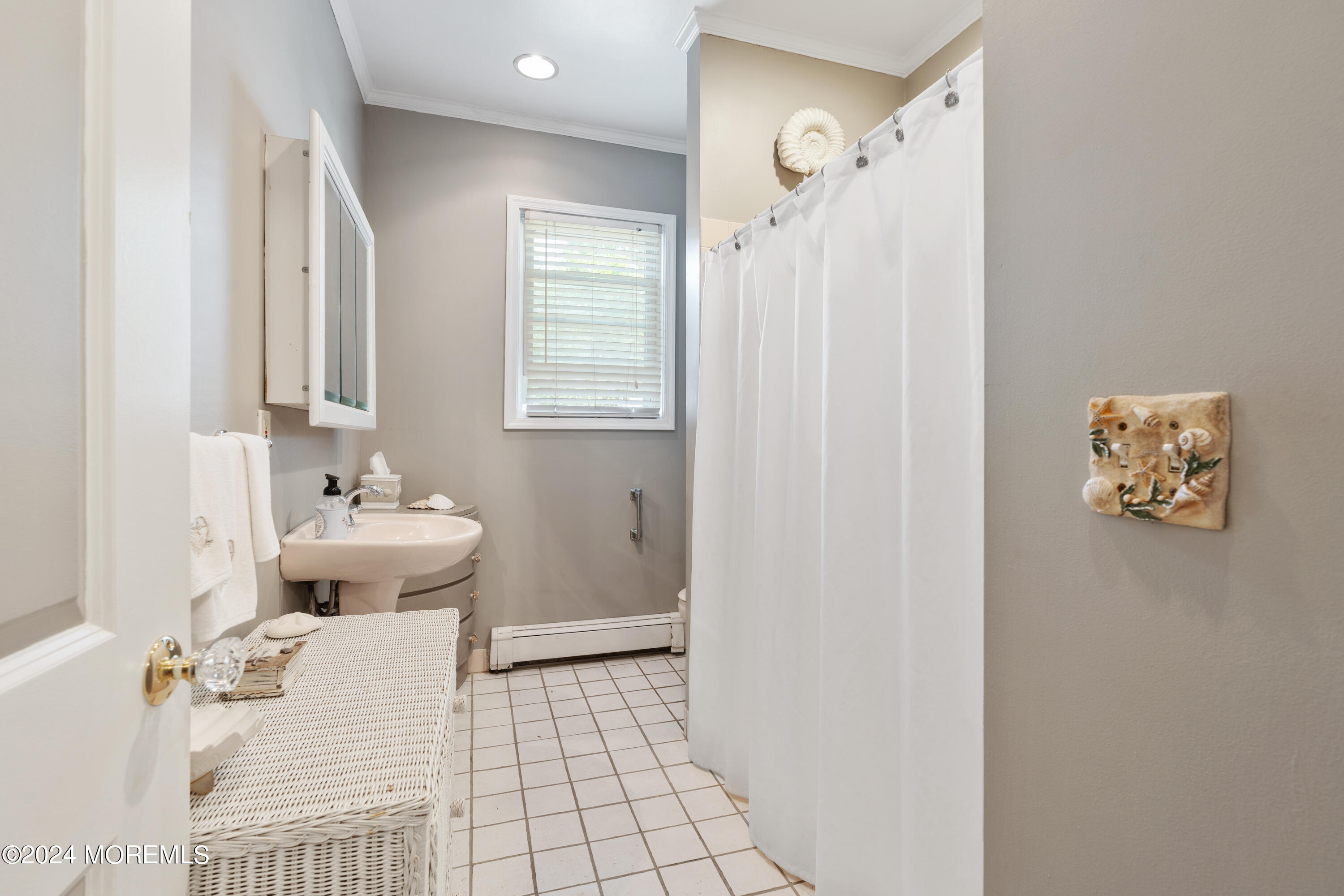 198 Pinckney Road Little Silver, NJ 07739 - Photo 11 of 20 a bathroom with a sink a toilet and shower