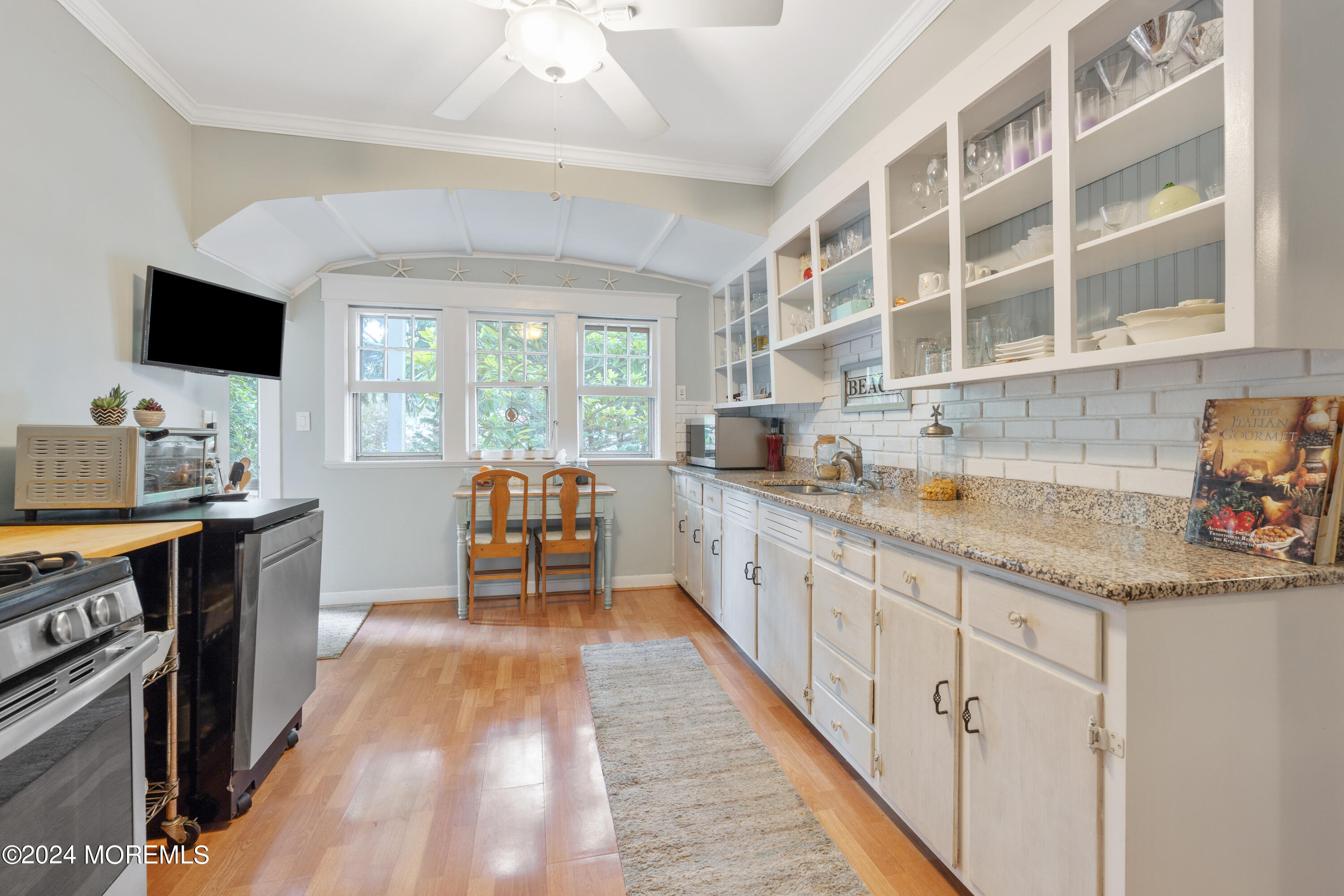 198 Pinckney Road Little Silver, NJ 07739 - Photo 6 of 20 a large kitchen with kitchen island granite countertop a sink and a stove top oven