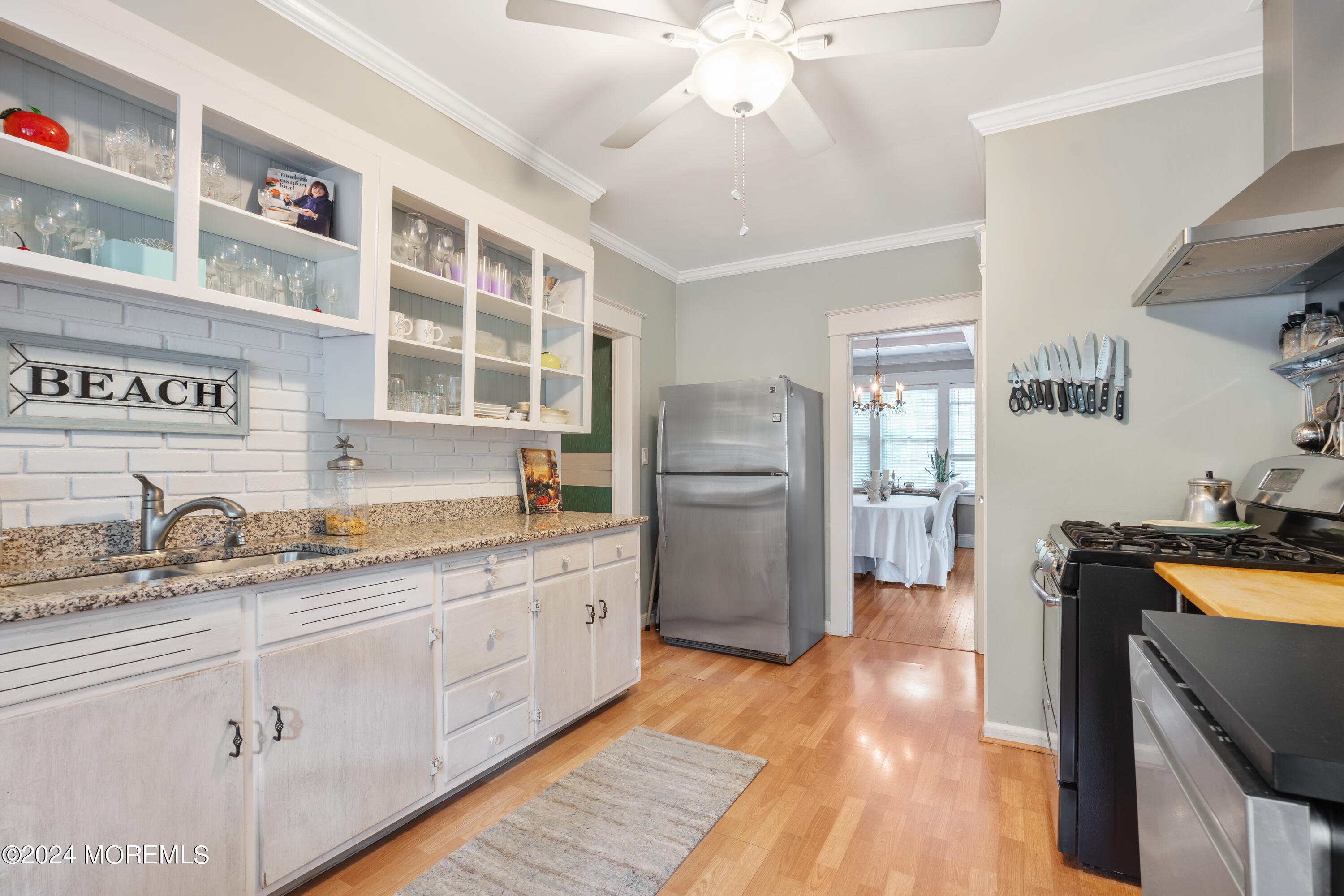 198 Pinckney Road Little Silver, NJ 07739 - Photo 7 of 20 a kitchen with refrigerator cabinets and wooden floor