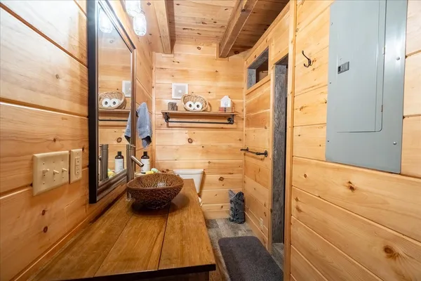 a view of a balcony with furniture and wooden floor