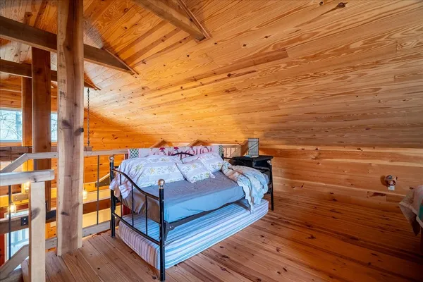 a view of a balcony with chair and wooden floor