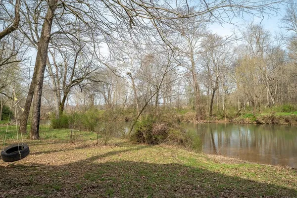 a house with trees in the background
