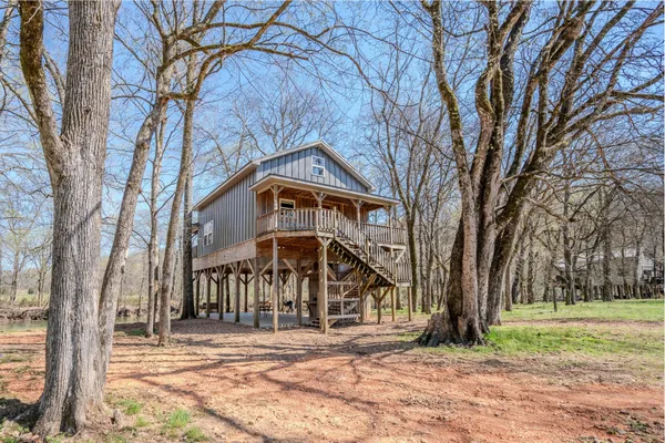 a view of a lake with a yard