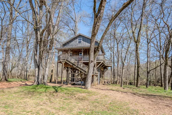 a view of a lake with a yard