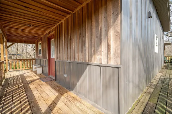 a view of a balcony with wooden floor