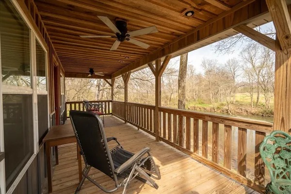a view of a chairs and table in the balcony