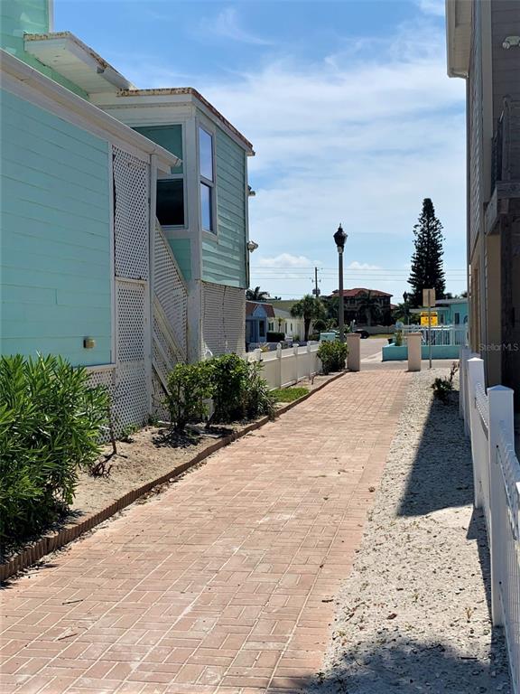 17688 Gulf Boulevard, Unit 104 Redington Shores, FL 33708 - Photo 13 of 15 a view of a backyard with sitting area