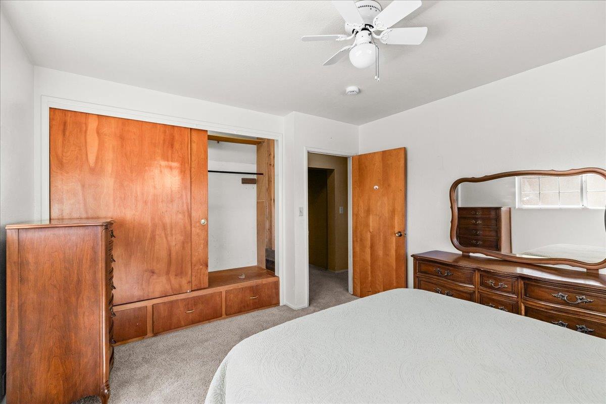 4701 Lone Tree Road Valley Home, CA 95361 - Photo 35 of 59 a bedroom with a bed and a television