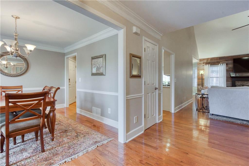 2521 Culpepper Trail Southeast Bethlehem, GA 30620 - Photo 19 of 83 a view of a dining room and livingroom with furniture wooden floor a chandelier