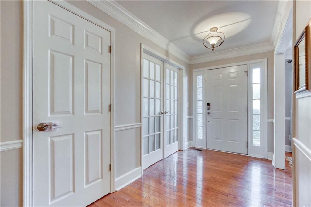 2521 Culpepper Trail Southeast Bethlehem, GA 30620 - Photo 21 of 83 a view of an empty room with wooden floor and a window