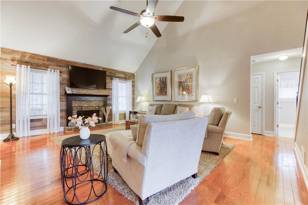 2521 Culpepper Trail Southeast Bethlehem, GA 30620 - Photo 26 of 83 a living room with fireplace furniture and a wooden floor