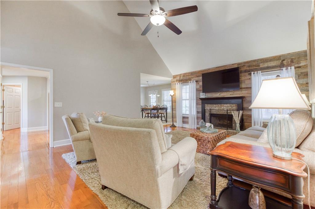 2521 Culpepper Trail Southeast Bethlehem, GA 30620 - Photo 27 of 83 a living room with furniture a fireplace and a flat screen tv