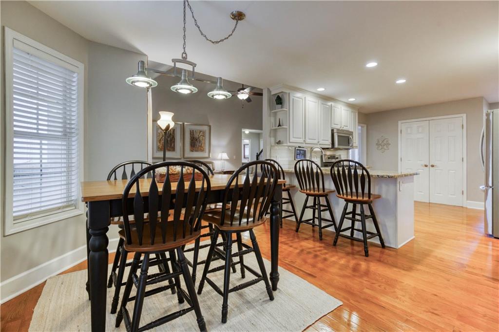 2521 Culpepper Trail Southeast Bethlehem, GA 30620 - Photo 36 of 83 a view of a dining room with furniture and wooden floor