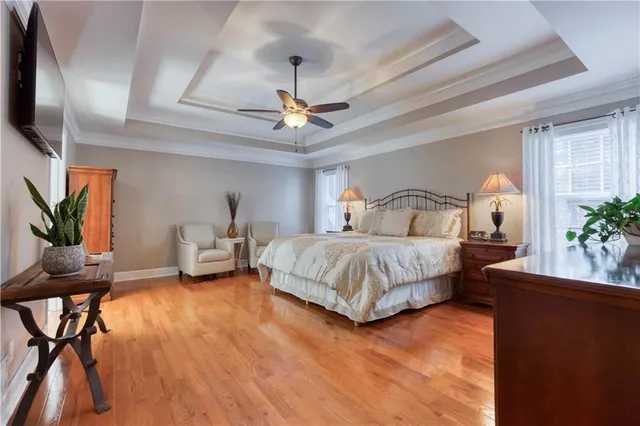 a view of empty room with wooden floor and fireplace