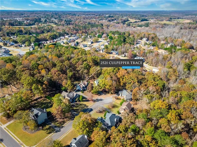 a view of house and yard with green space