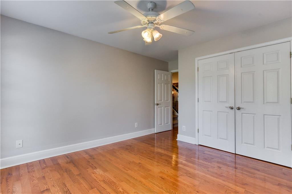 2521 Culpepper Trail Southeast Bethlehem, GA 30620 - Photo 49 of 83 an empty room with wooden floor a ceiling fan and closet