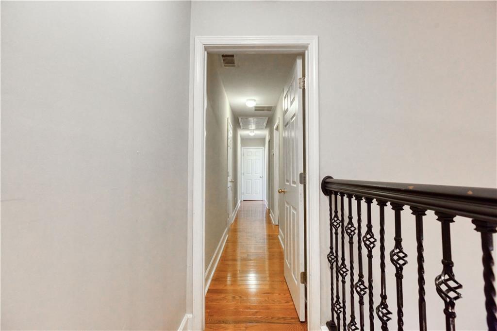 2521 Culpepper Trail Southeast Bethlehem, GA 30620 - Photo 53 of 83 a view of a hallway with wooden floor and a bathroom