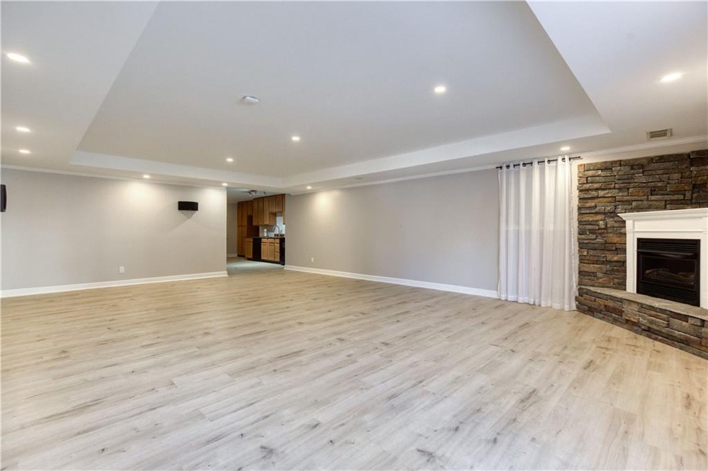 2521 Culpepper Trail Southeast Bethlehem, GA 30620 - Photo 63 of 83 a view of empty room with wooden floor and fireplace