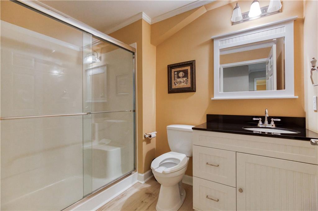 2521 Culpepper Trail Southeast Bethlehem, GA 30620 - Photo 67 of 83 a bathroom with a granite countertop toilet sink and shower