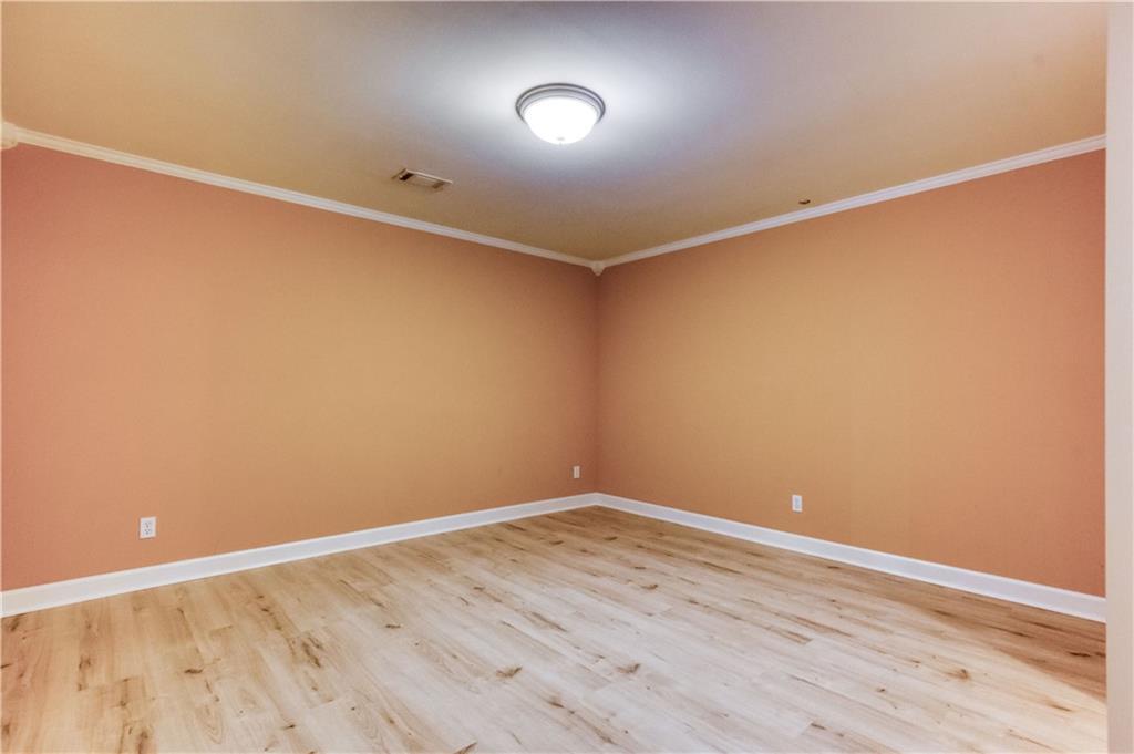 2521 Culpepper Trail Southeast Bethlehem, GA 30620 - Photo 68 of 83 a view of an empty room with wooden floor