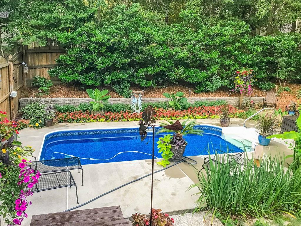 2521 Culpepper Trail Southeast Bethlehem, GA 30620 - Photo 82 of 83 a view of a chairs and table in a backyard