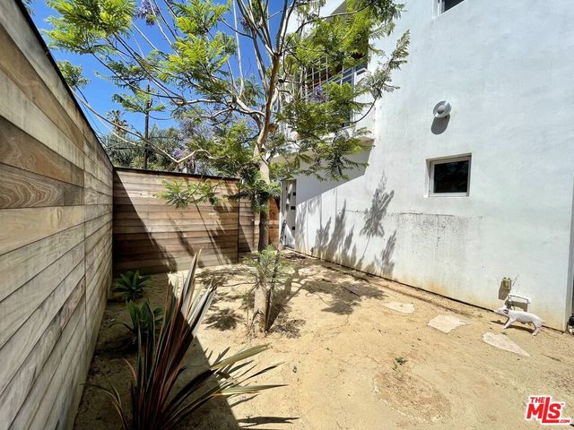 a view of a backyard of the house