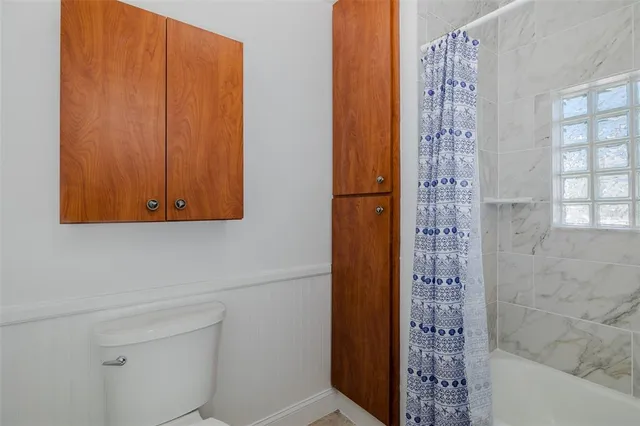 a view of a lake with a house in the background