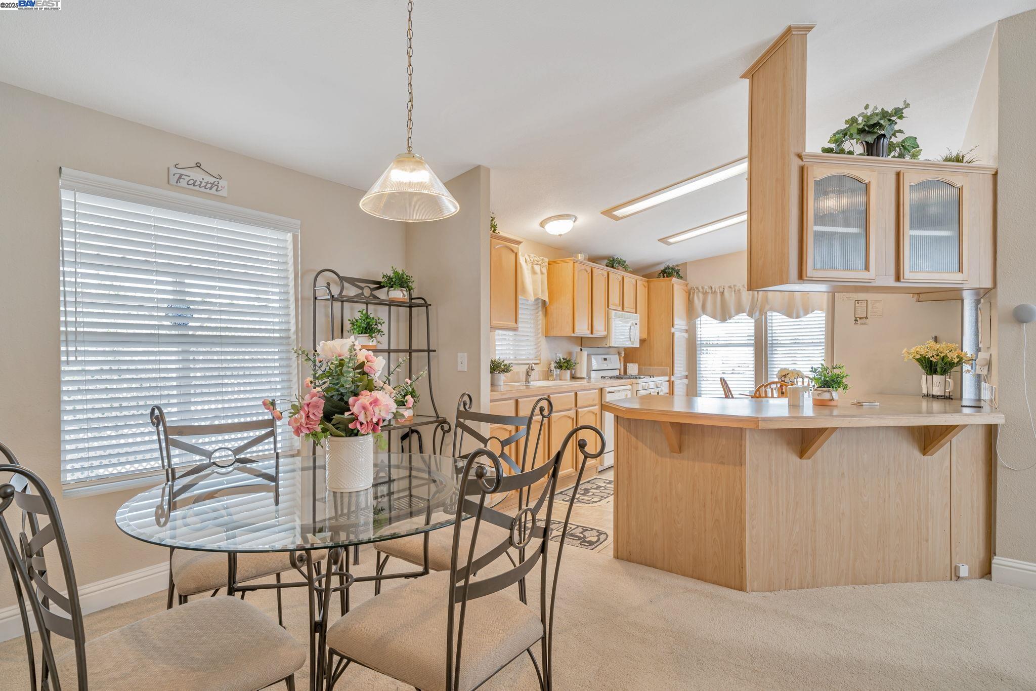 3263 Vineyard, Unit 68 Pleasanton, CA 94566 - Photo 14 of 41 a dining room filled with furniture and window