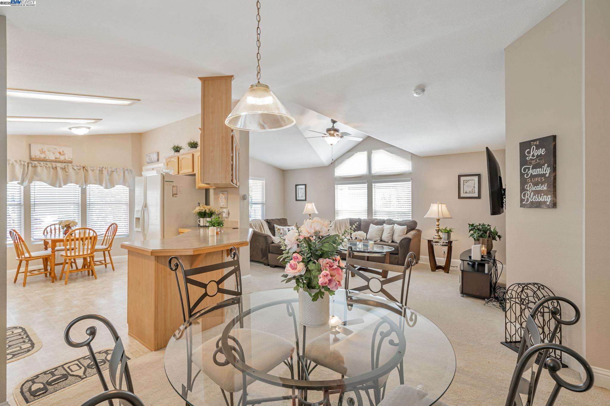 3263 Vineyard, Unit 68 Pleasanton, CA 94566 - Photo 17 of 41 a view of a dining room and livingroom with furniture wooden floor a chandelier