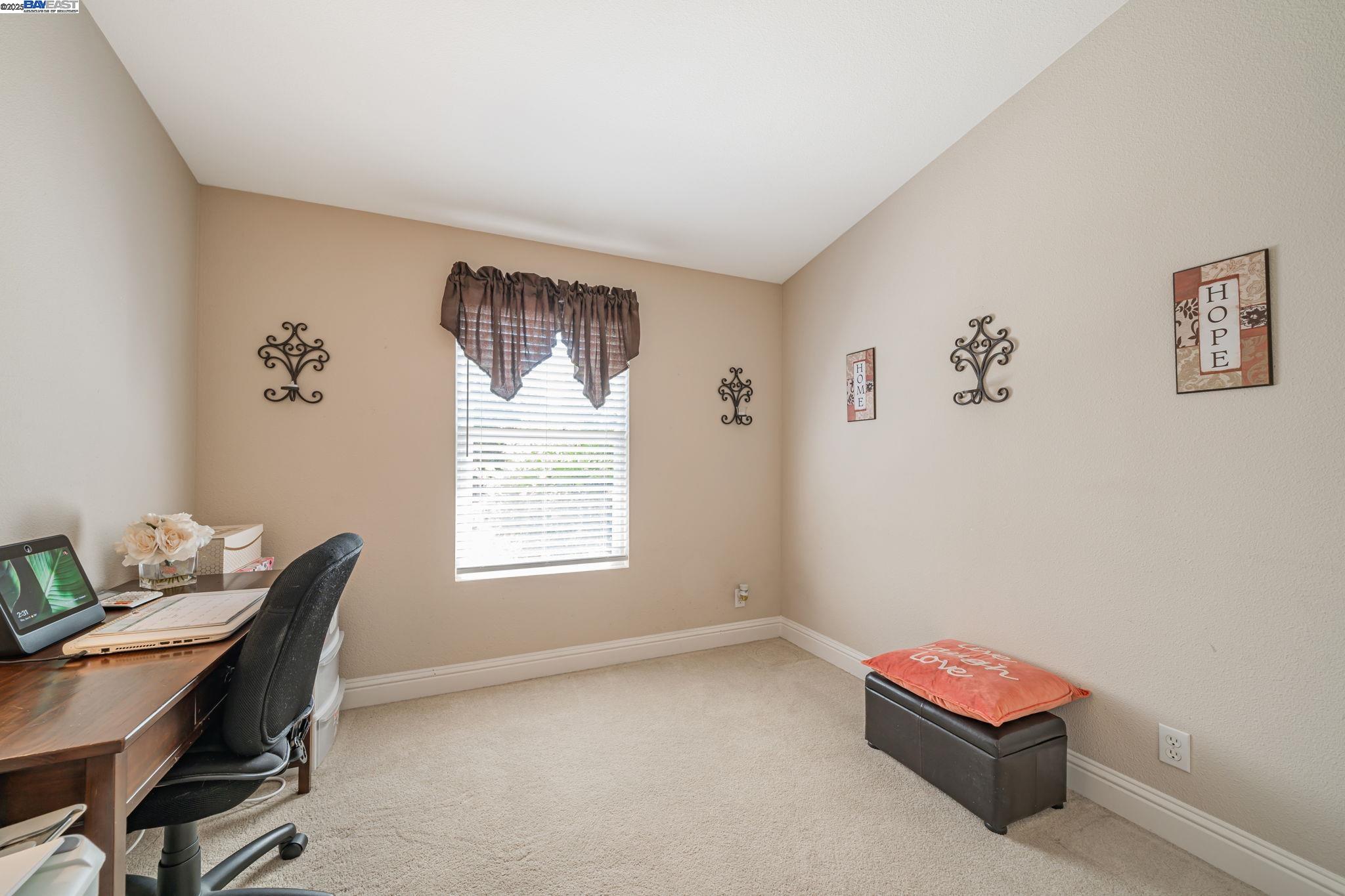 3263 Vineyard, Unit 68 Pleasanton, CA 94566 - Photo 18 of 41 a living room with furniture and a window