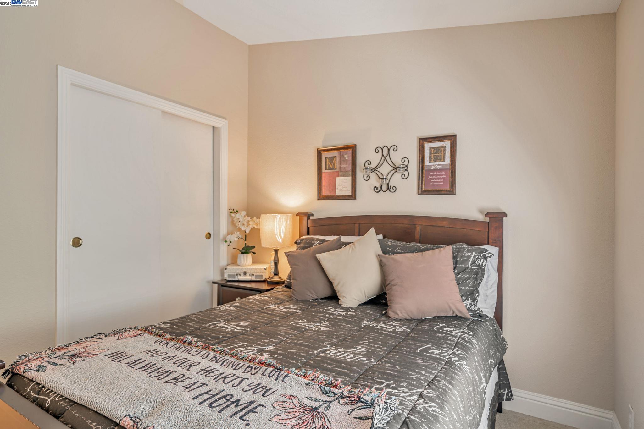 3263 Vineyard, Unit 68 Pleasanton, CA 94566 - Photo 22 of 41 a bedroom with a bed and a window