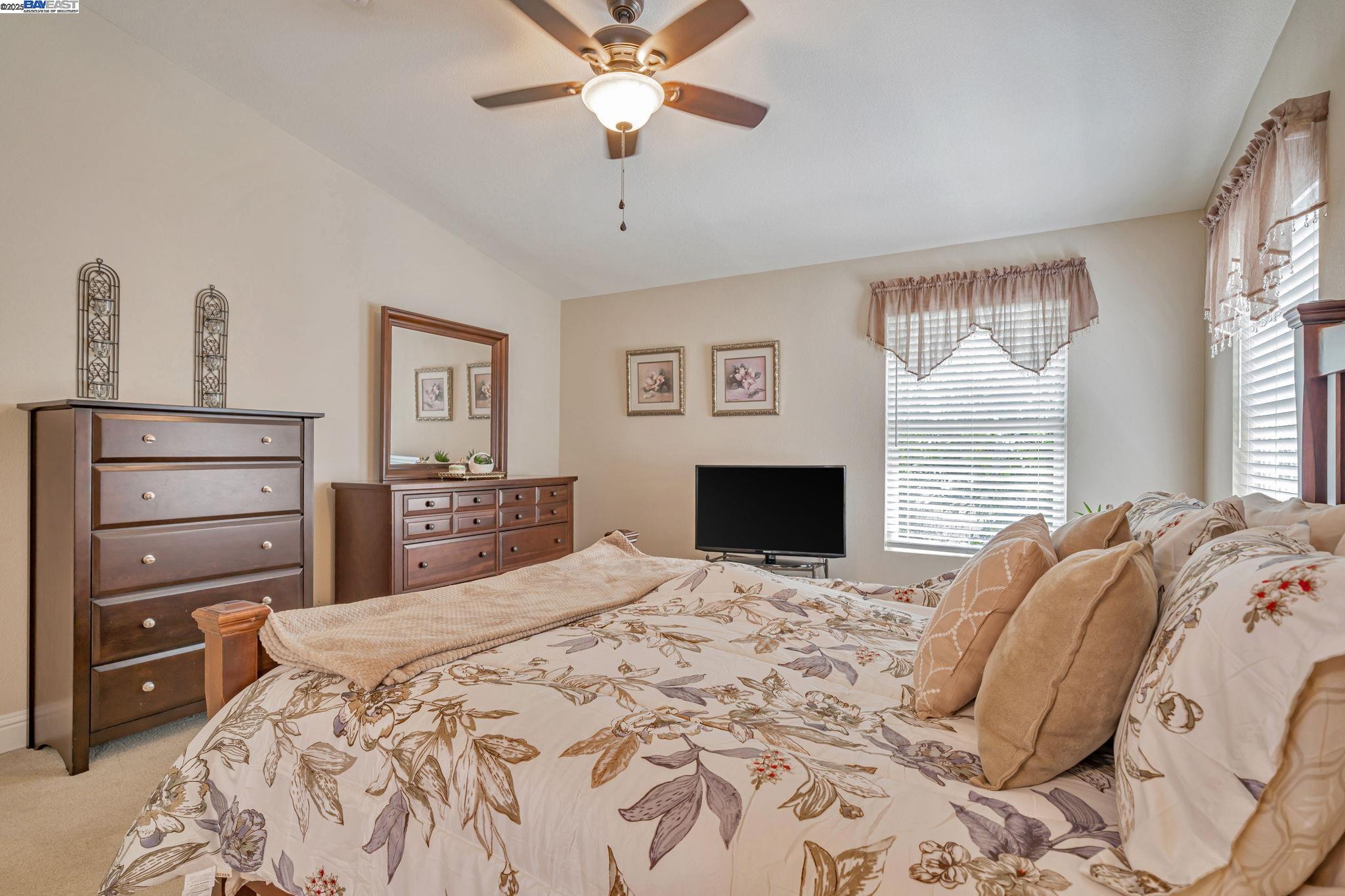 3263 Vineyard, Unit 68 Pleasanton, CA 94566 - Photo 25 of 41 a bedroom with a bed and a fireplace