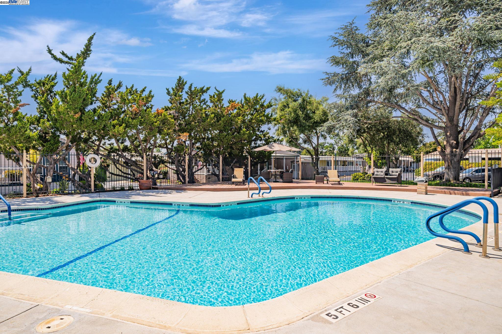 3263 Vineyard, Unit 68 Pleasanton, CA 94566 - Photo 39 of 41 a view of swimming pool and trees in the background