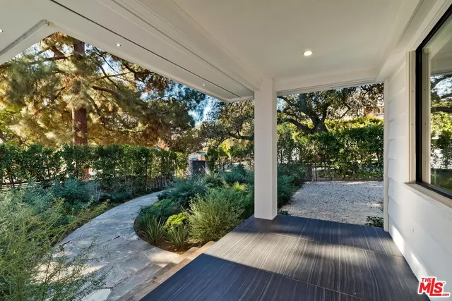 a view of backyard with garden and plants