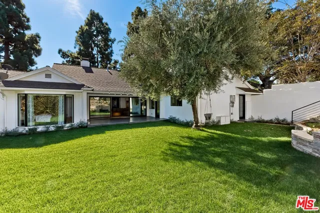 a front view of a house with a garden and porch