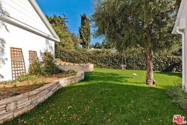 a view of a backyard with a garden