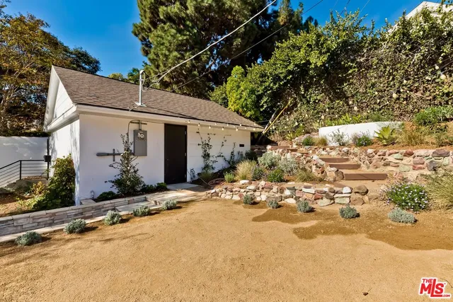 a view of a house with a snow in the yard