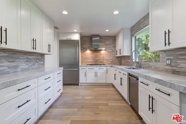 a large kitchen with cabinets