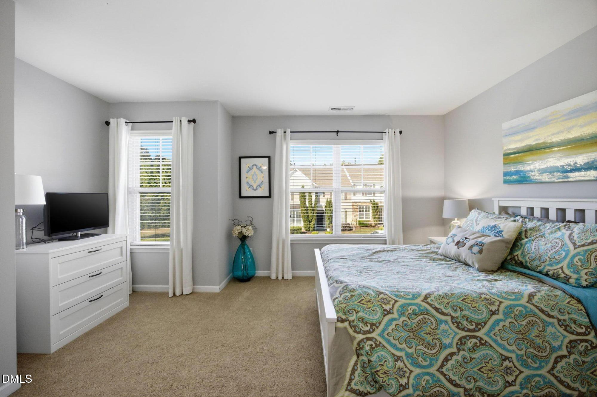 2827 Corbett Grove Drive Raleigh, NC 27616 - Photo 26 of 49 a bedroom with a bed and a flat screen tv