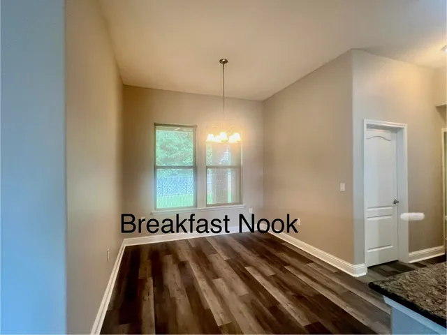 a view of a room with lots of wooden floor