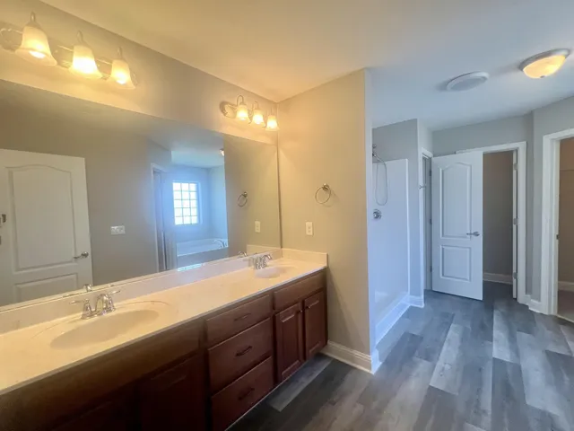 a white bath tub sitting next to a window