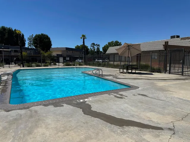 a view of a swimming pool with a lounge chairs