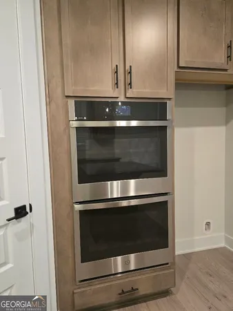 a open kitchen with stainless steel appliances granite countertop a refrigerator and a sink